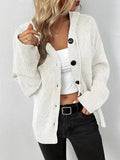 A solid colour hooded cotton cardigan sweater shown in a loose fit on a model.