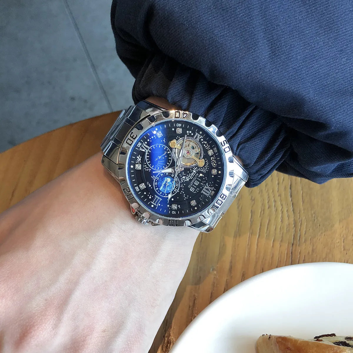 Men's silver case automatic watch with black dial on a genuine leather strap