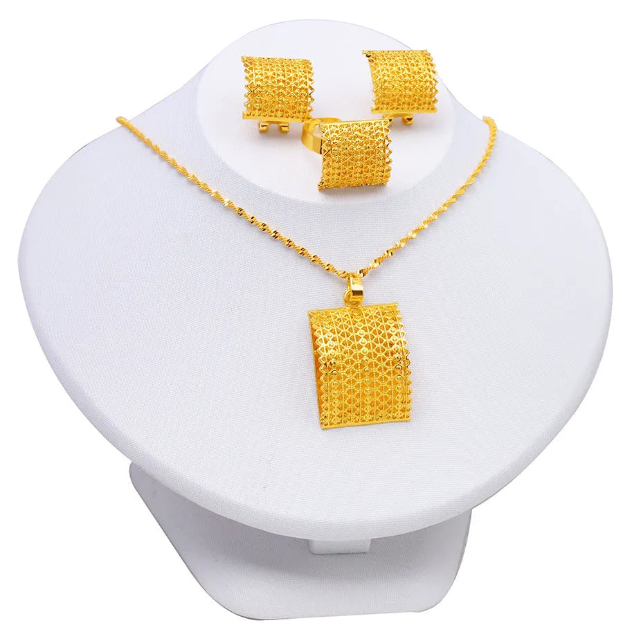Gold tone bridal jewellery set with necklace, earrings and ring on display