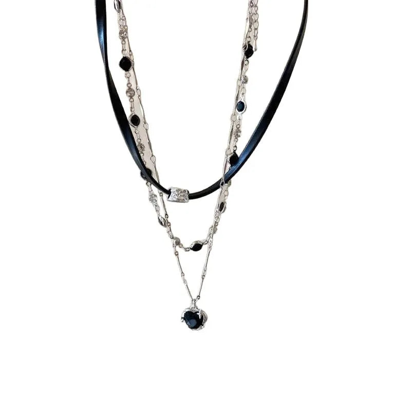 Women's twin-layer necklace with a leather-wrapped heart-shaped alloy pendant on an adjustable chain.