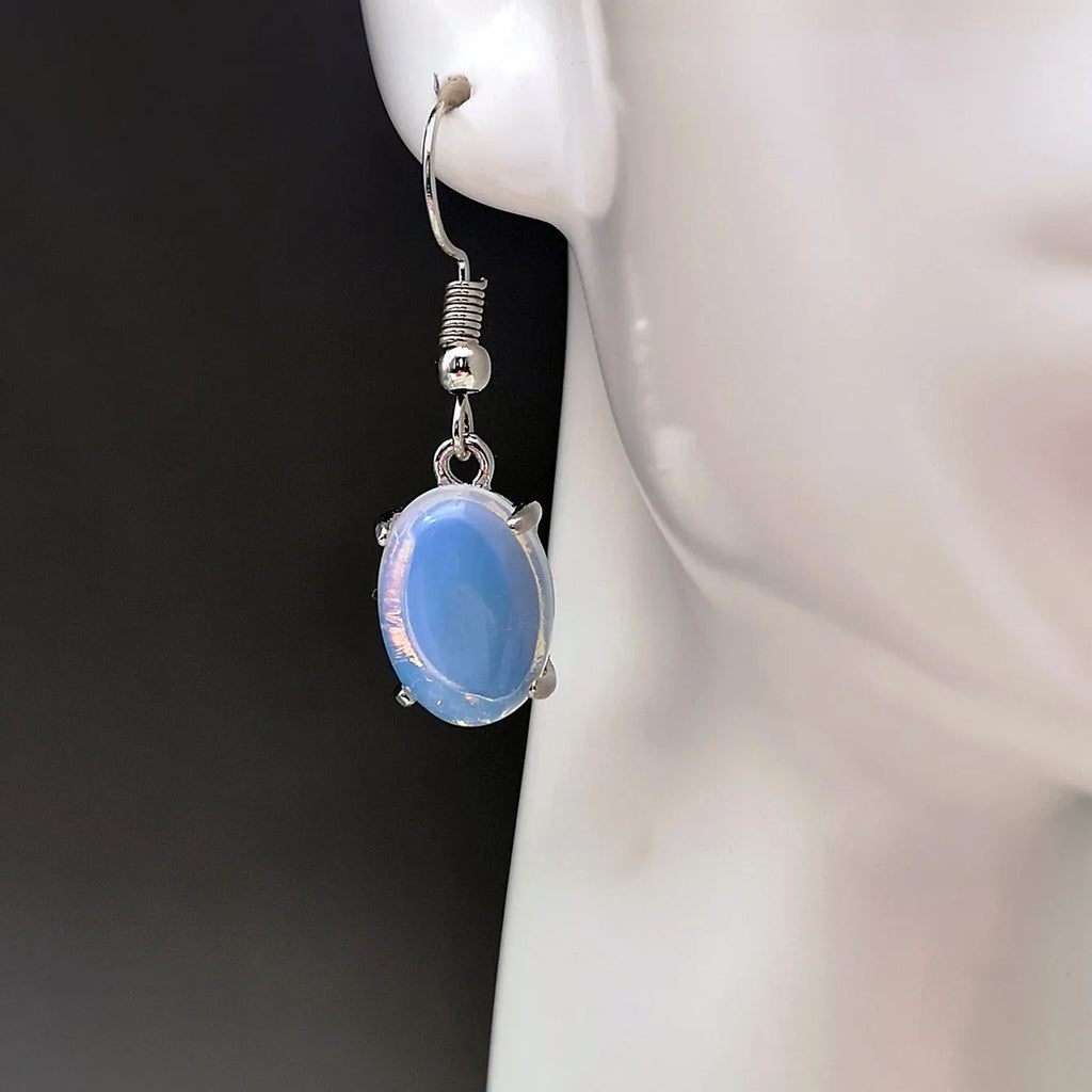 Moonlight white opal drop earrings with retro cross detail and electroplated finish