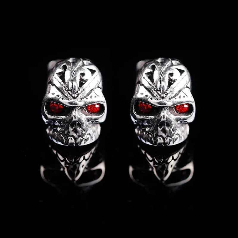 Retro ghost head skull stud earrings with red eye detailing on electroplated alloy