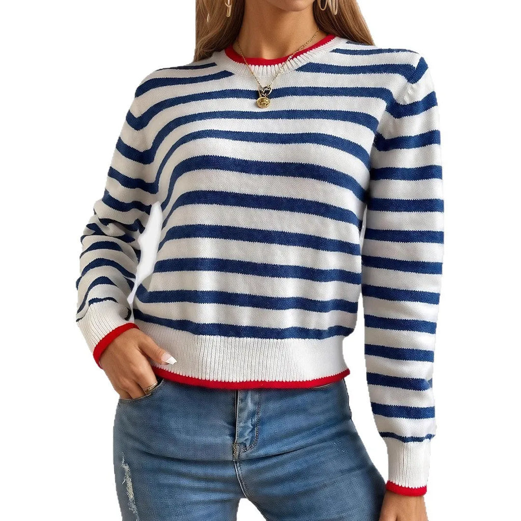 Sapphire blue striped loose fit pullover sweater with round neck and long sleeves on a hanger.