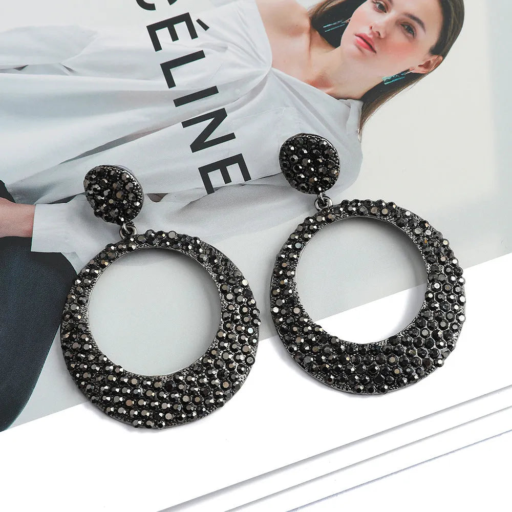 Colourful cartoon-style metal pendant earrings with a large round base and diamond shape for women.