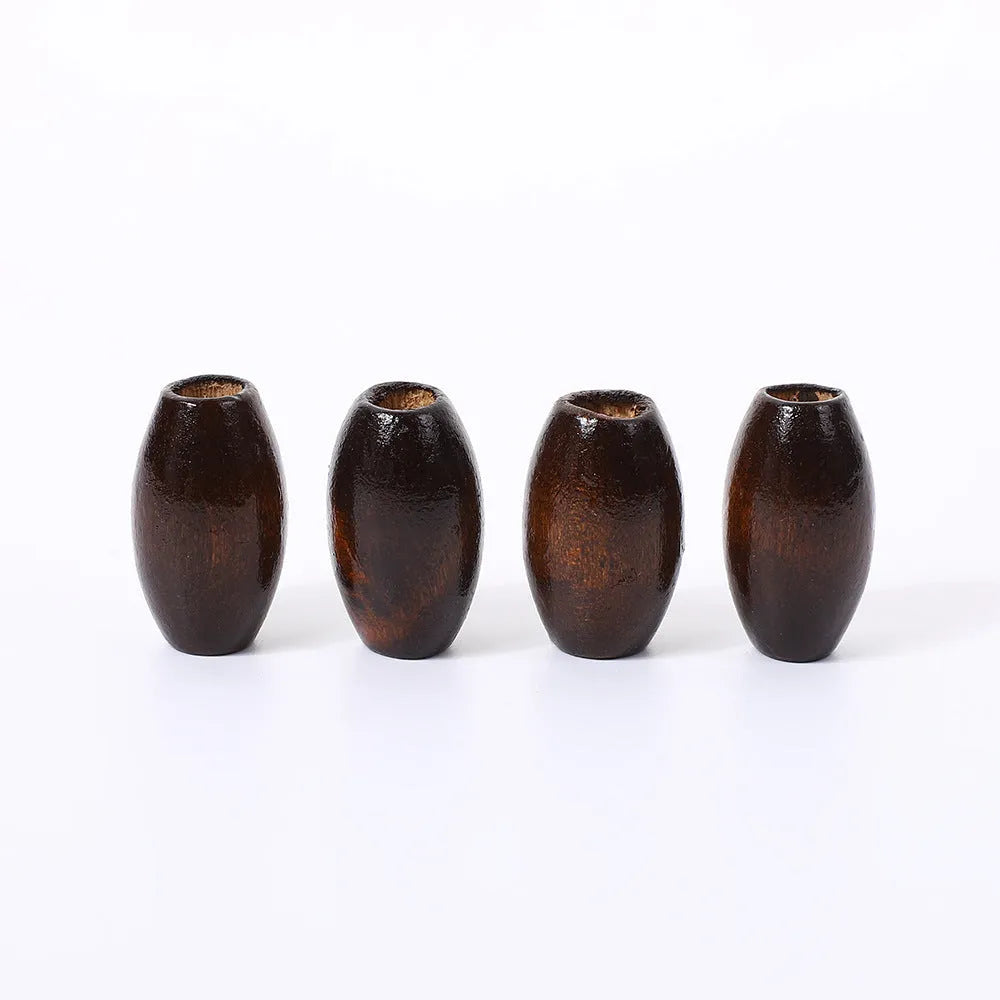 Oval wooden bead with M-shaped raised texture in dark coffee colour, showing 25mm dimensions
