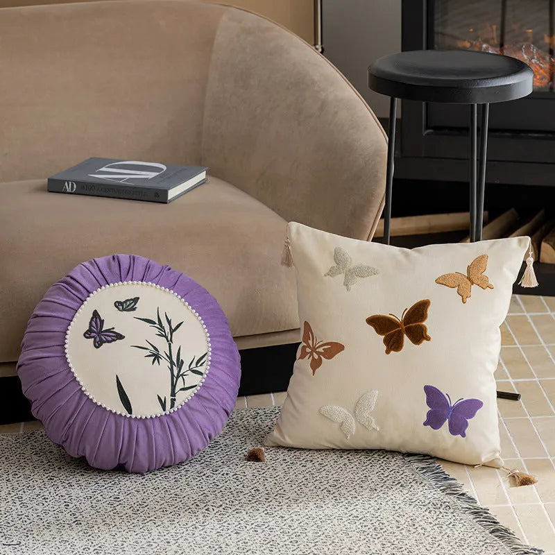 Square cushion with Chinese butterfly embroidery in beige, black, or purple colours.