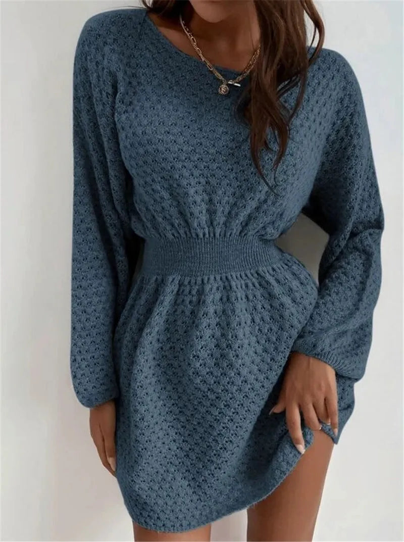 Blue women's knitted dress with hand-crocheted flowers, round neck, and fitted waist.