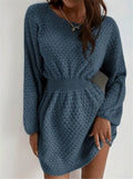 Blue women's knitted dress with hand-crocheted flowers, round neck, and fitted waist.