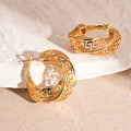 Geometric women's hollow stud earrings in gold or silver with exaggerated twisted round design