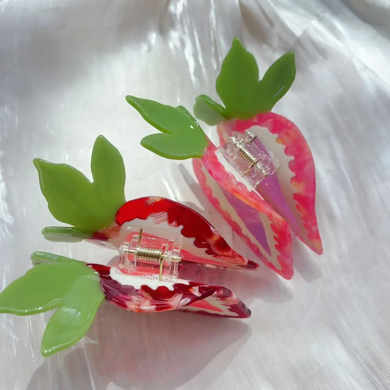 Handcrafted strawberry hairpin in pastoral style showing red and pink colour options
