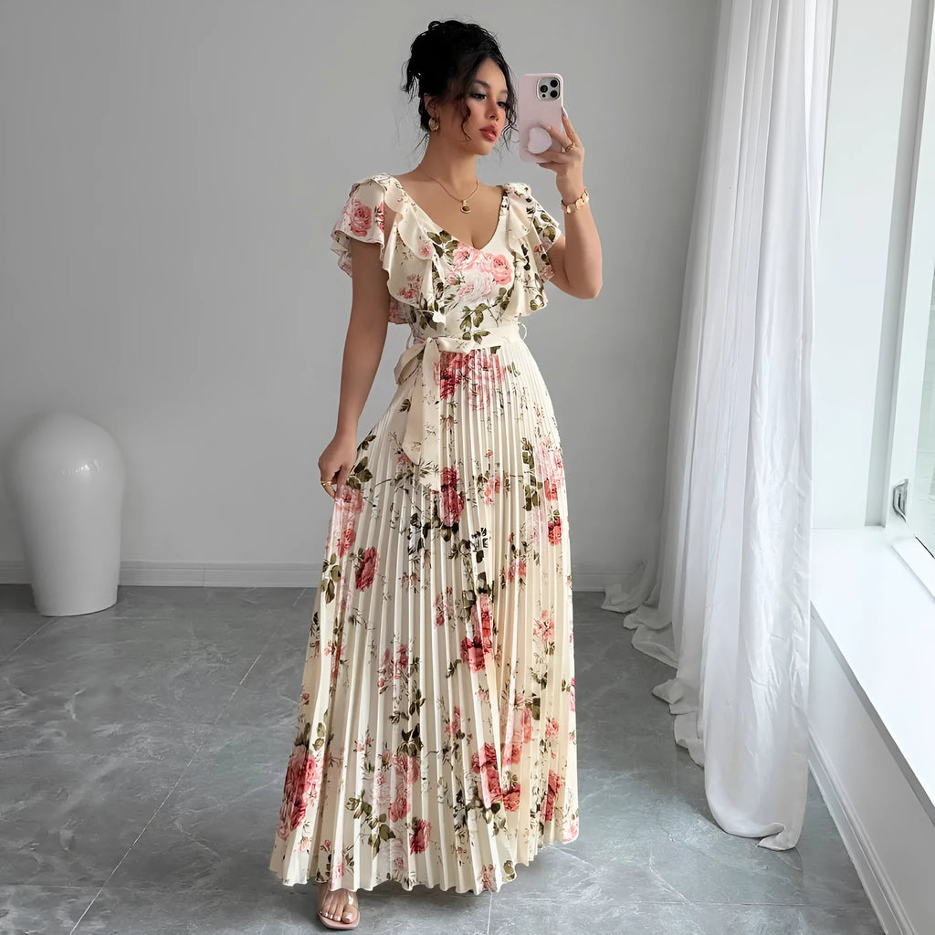 Apricot coloured floral print V-neck dress with ruffled sleeves and a pleated swing skirt.