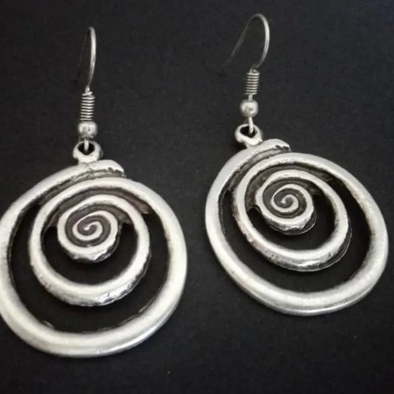 Geometric spiral earrings with distressed silver finish, measuring 5cm long