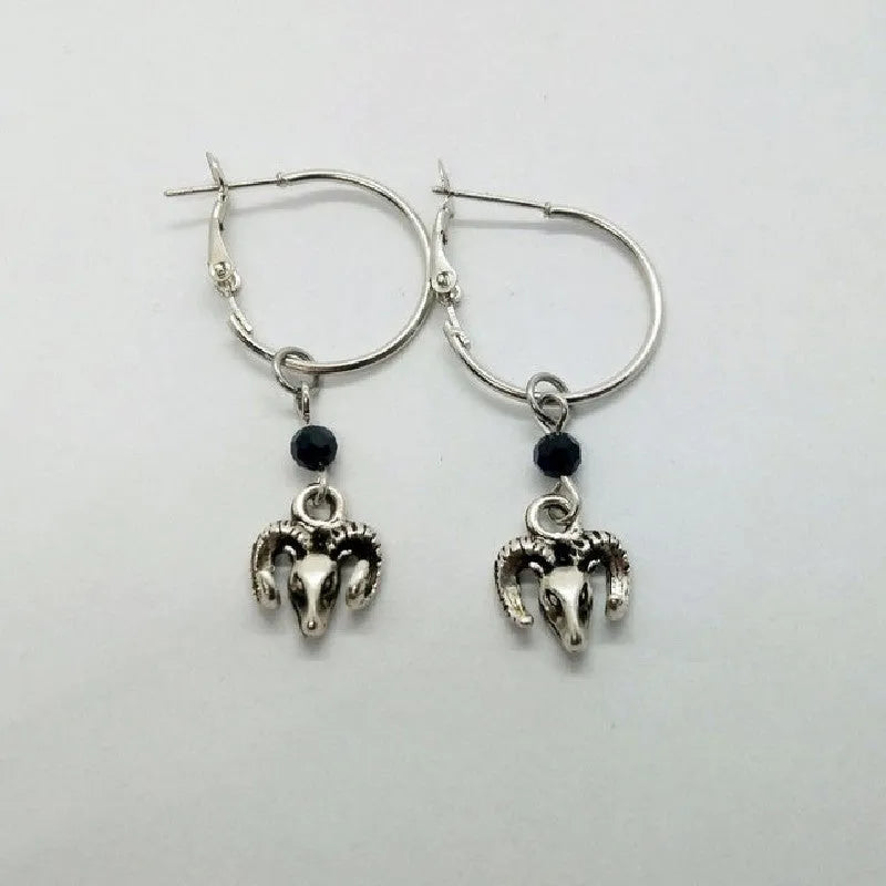 Silver round ring alloy earrings with Tibetan antelope design from Yunnan.
