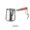 Stainless steel latte art milk jug with wooden handle in 350ml, 600ml, or 1000ml capacity options