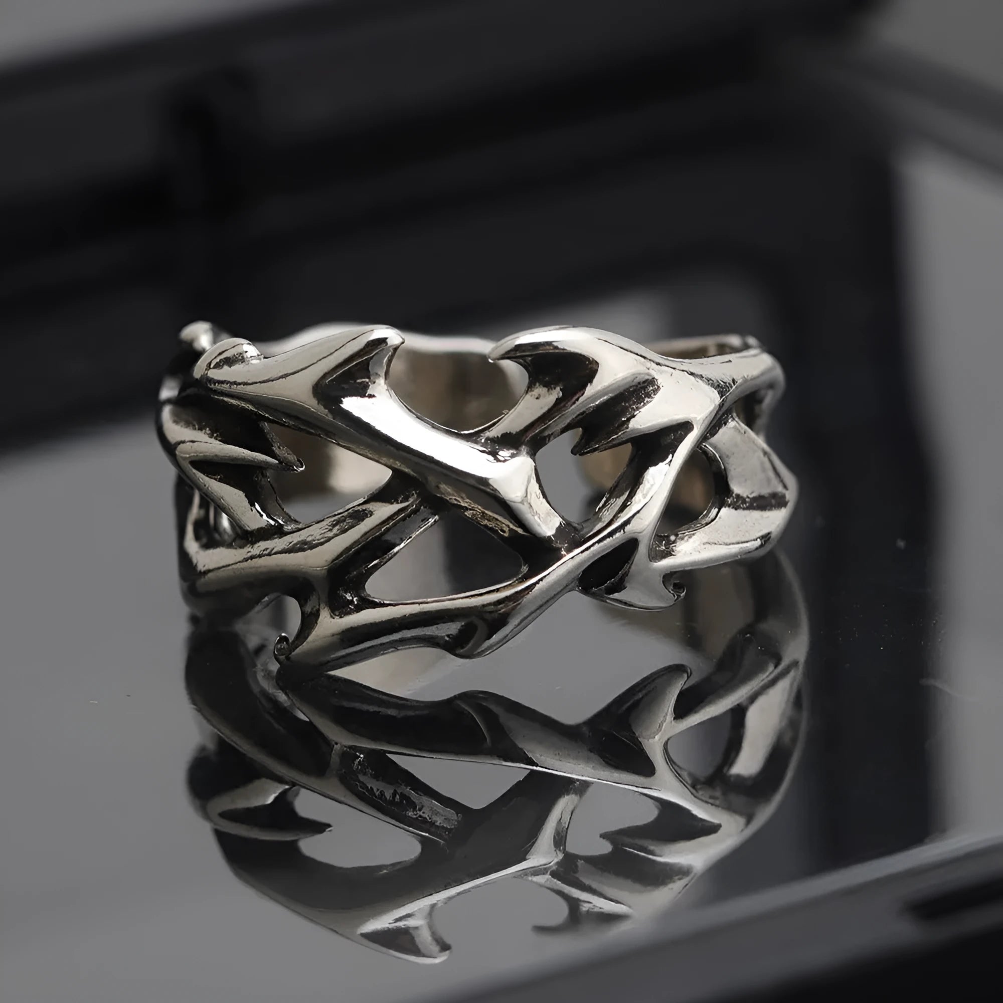 Copper men's ring with geometric thorn flower design and adjustable opening.