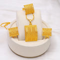 Gold tone bridal jewellery set with necklace, earrings and ring on display
