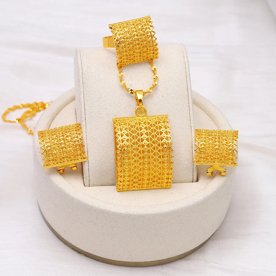 Gold tone bridal jewellery set with necklace, earrings and ring on display