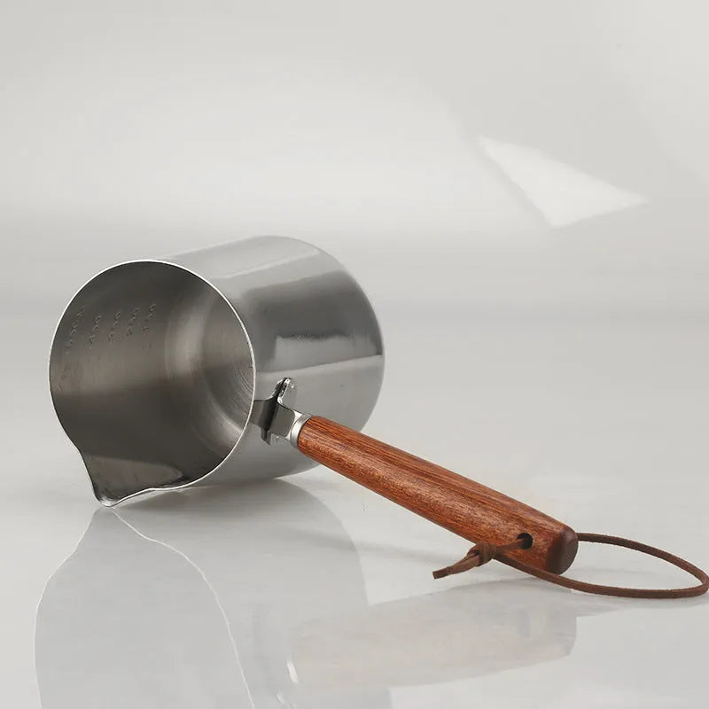 Stainless steel latte art milk jug with wooden handle in 350ml, 600ml, or 1000ml capacity options