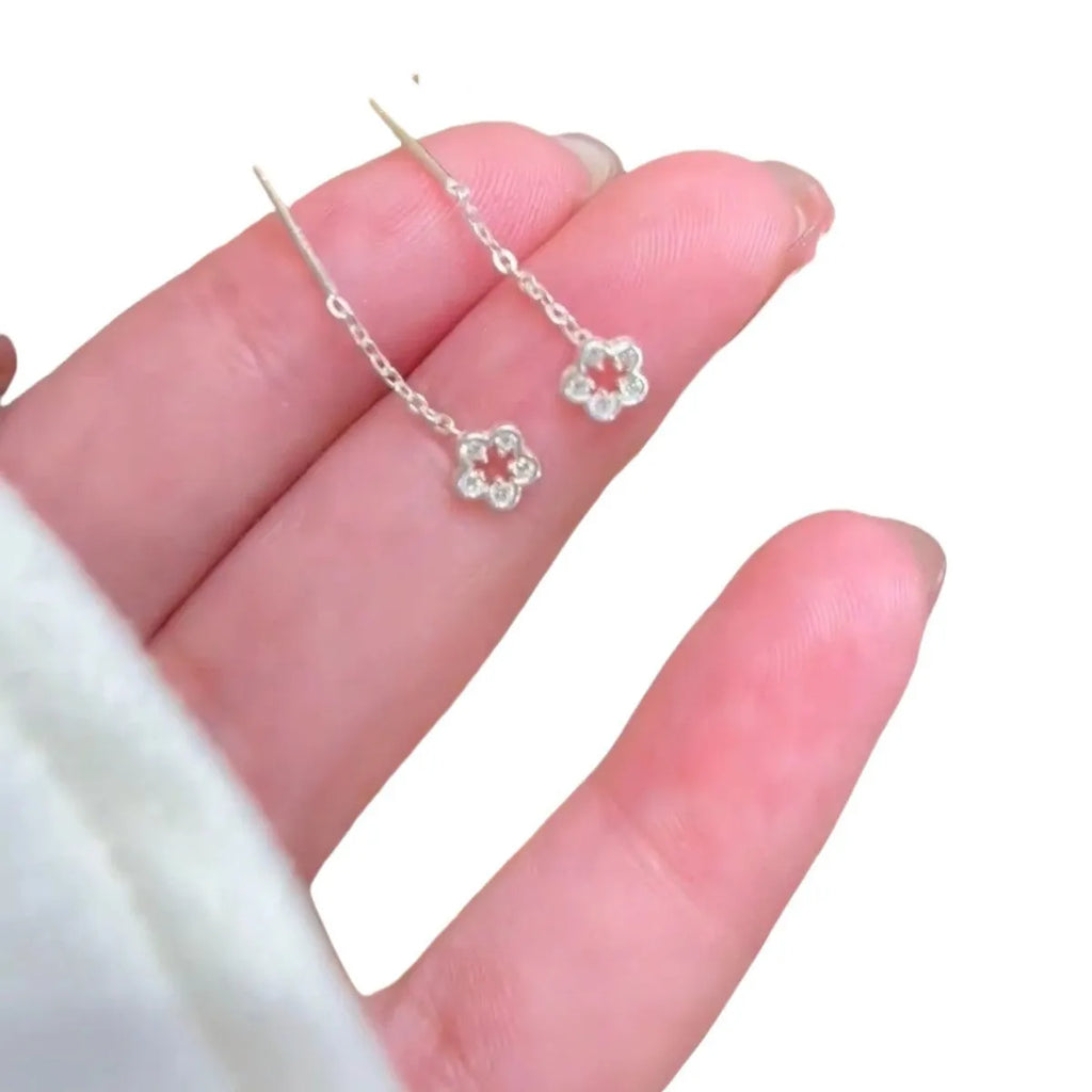 Pair of alloy silver hollow flower hanging earrings