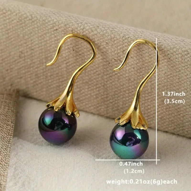 Gold retro fashion women's earrings with personalised creative design and alloy construction