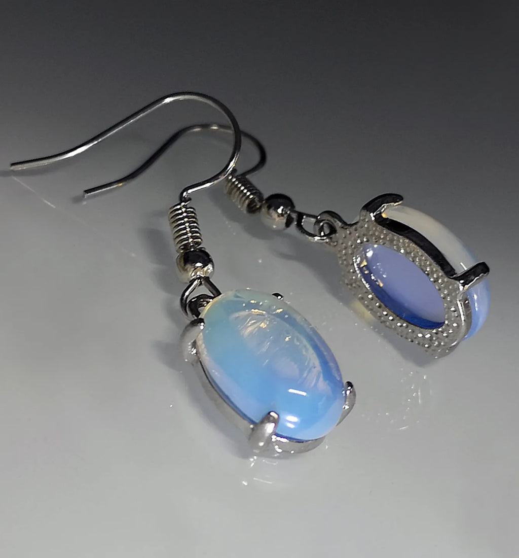 Moonlight white opal drop earrings with retro cross detail and electroplated finish