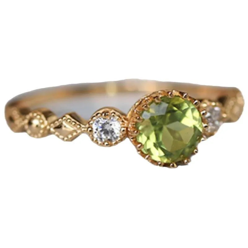 Copper women's ring with a green geometric quadrilateral stone in a Japanese style design.