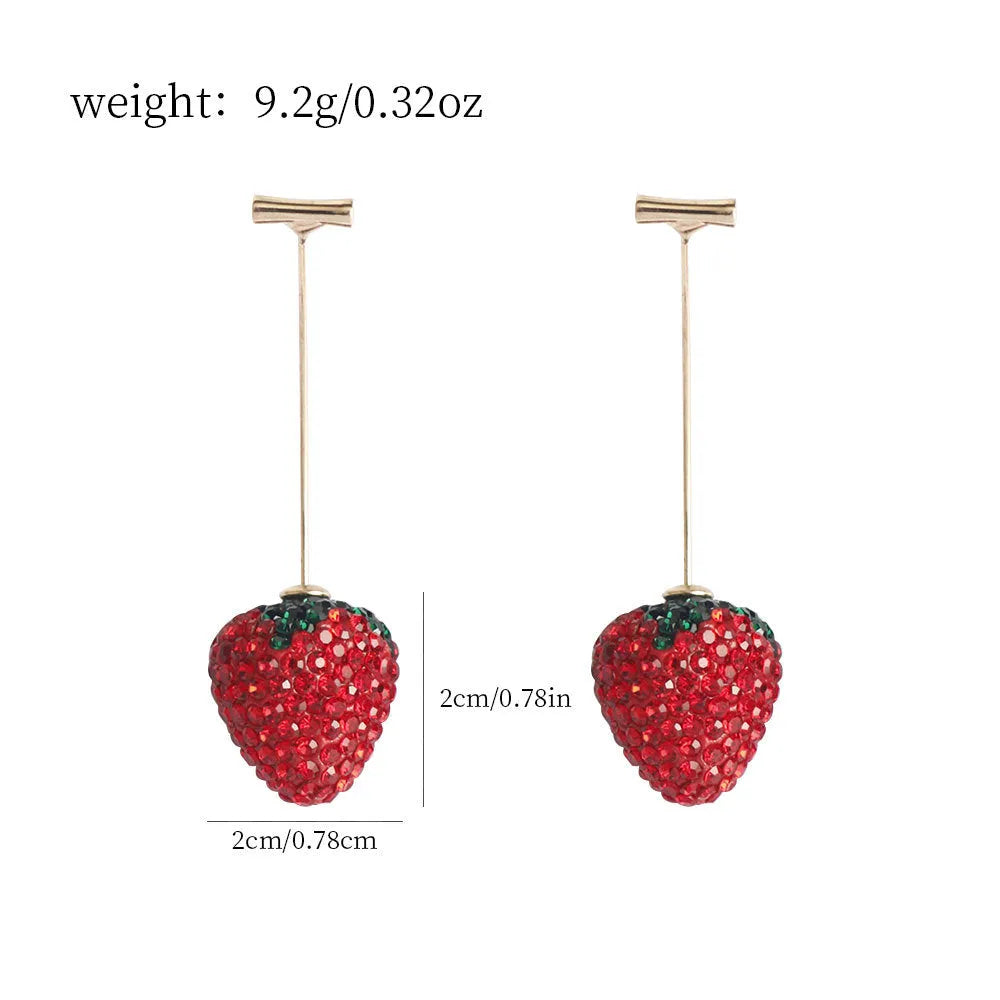 Geometric zinc alloy women's earrings with a red strawberry charm on a white background.