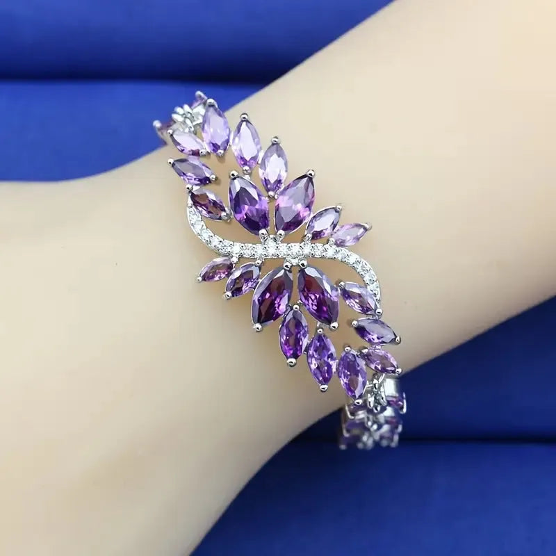 Copper fashion bracelet with gold electroplating and coloured zircon stones in ice flower design