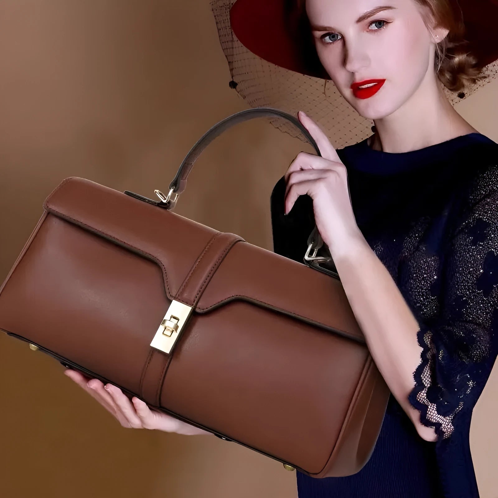 Women's genuine cowhide messenger bag in cylindrical shape with internal organisers