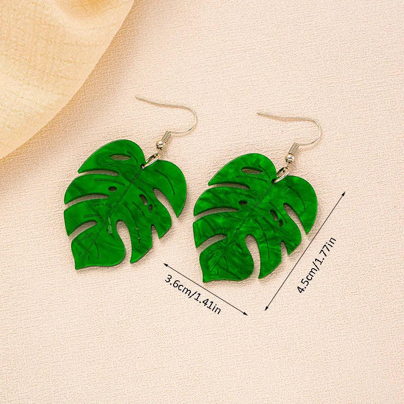 Women's alloy drop earrings with red and green acrylic jackfruit and coconut charms on a white background.