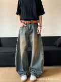 Men's retro blue distressed denim jeans with a slimming wide-leg fit and machete wash detail.