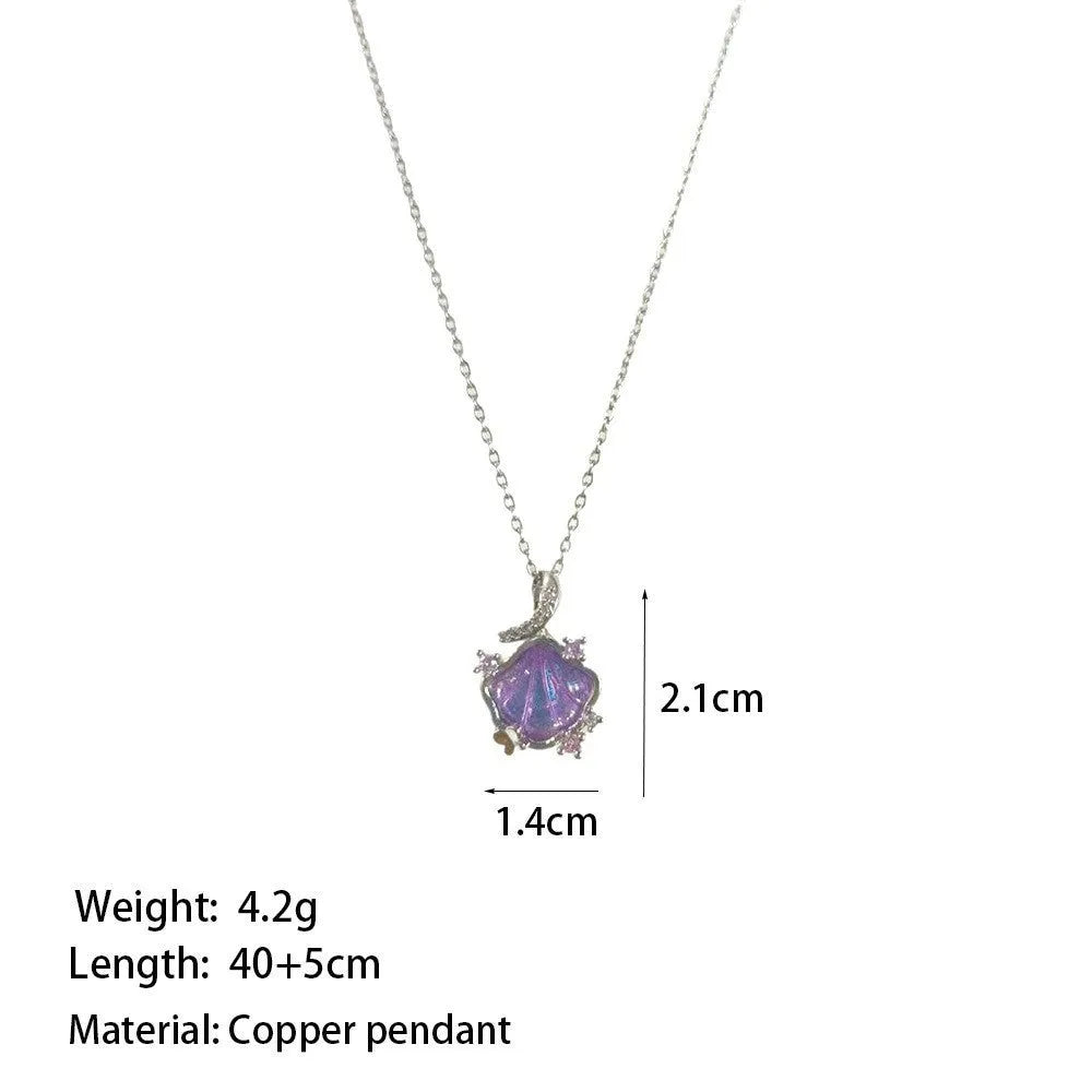 Geometric shell pendant necklace with electroplated copper pendant on stainless steel O-shaped chain, close-up view