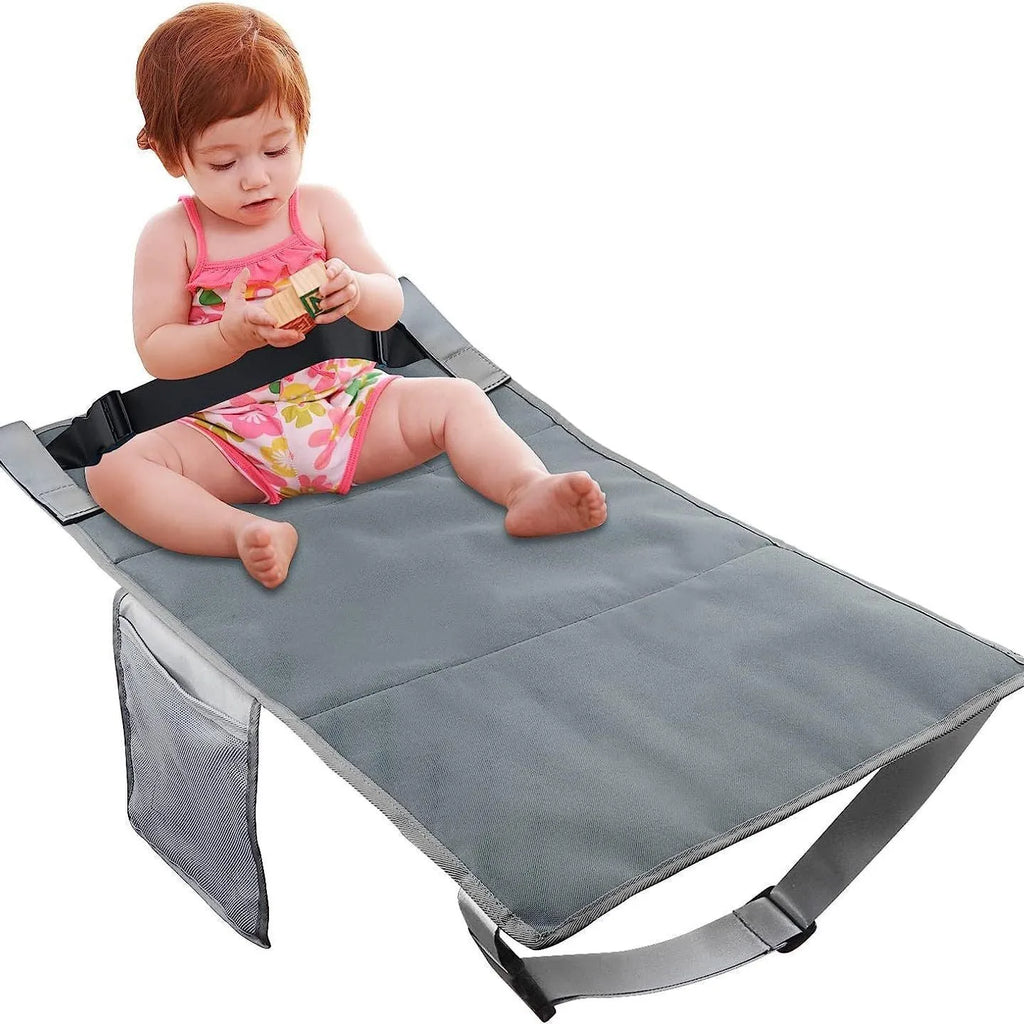 Portable blue nylon children's aircraft seat extender with matching storage bundle pocket.