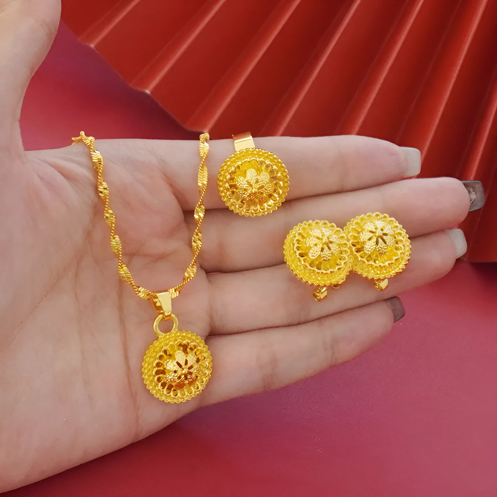 Gold-plated women's three-piece jewelry set showing necklace with floral pendant, matching earrings, and ring
