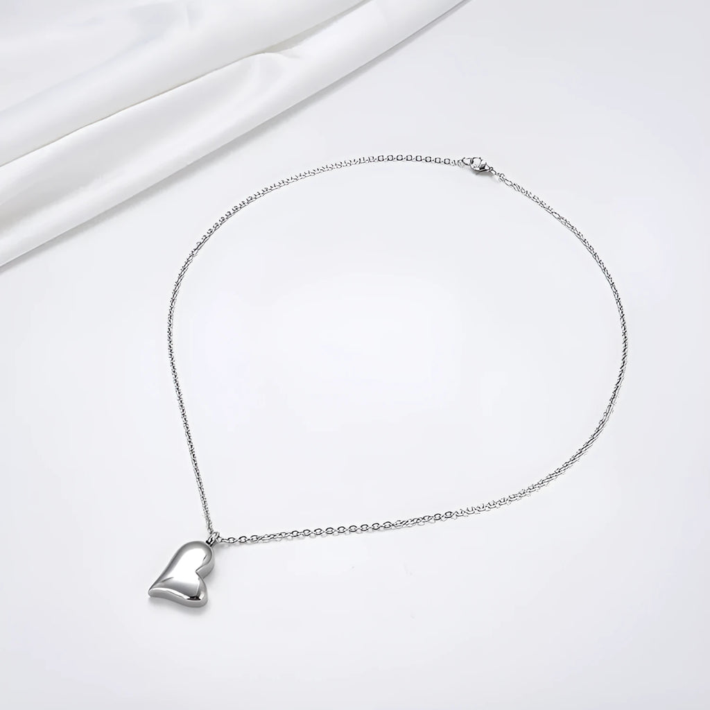 Curved peach heart stainless steel pendant necklace with silver electroplated finish on 51cm chain