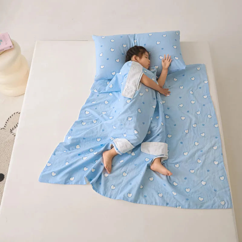 Patterned anti-kick sleeping bag blanket laid flat on a bed, showing its quilted texture.