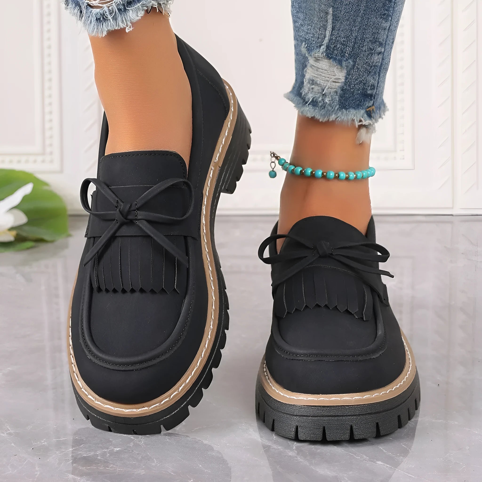 Black plus size women's loafers with tassel decoration, bowknot detail, and chunky heel