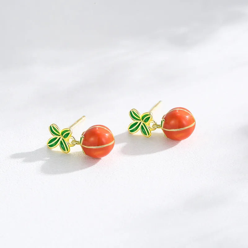 S925 sterling silver persimmon fruit stud earrings with lucky symbol design