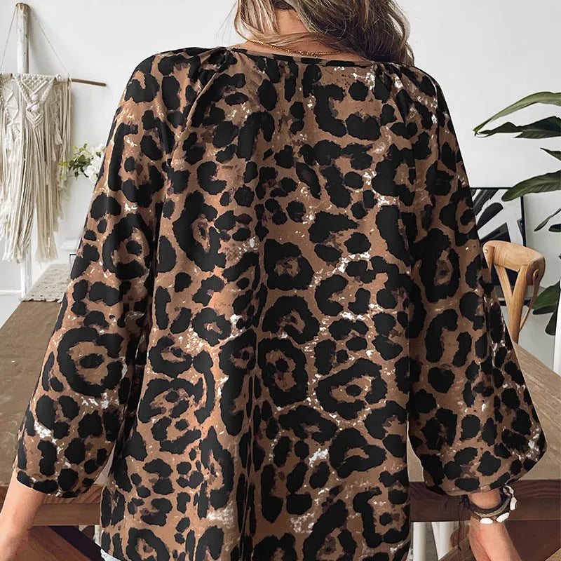 Women's multicolor leopard print polyester pullover top with V-neck and half sleeves.