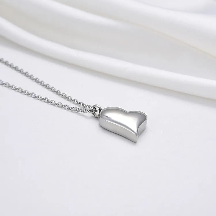 Curved peach heart stainless steel pendant necklace with silver electroplated finish on 51cm chain