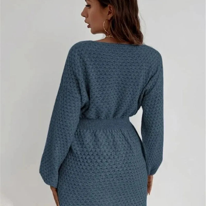 Blue women's knitted dress with hand-crocheted flowers, round neck, and fitted waist.