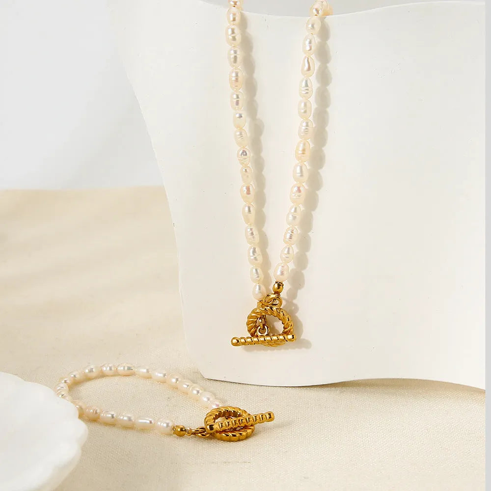 Freshwater pearl and stainless steel necklace bracelet set with geometric shapes on clavicle chain