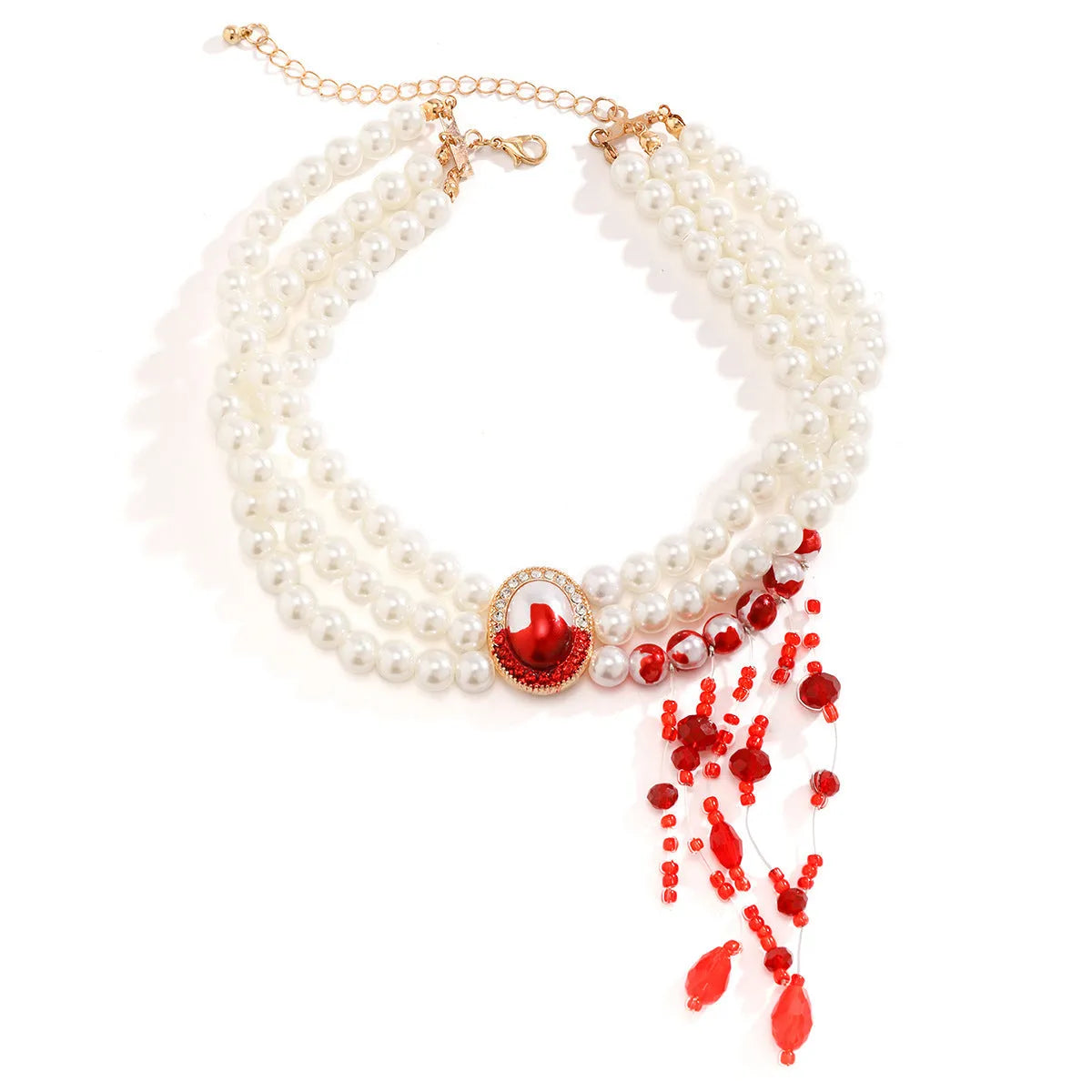 Gothic style gold electroplated pearl collar necklace set with matching bracelet and stud earrings on a dark background.