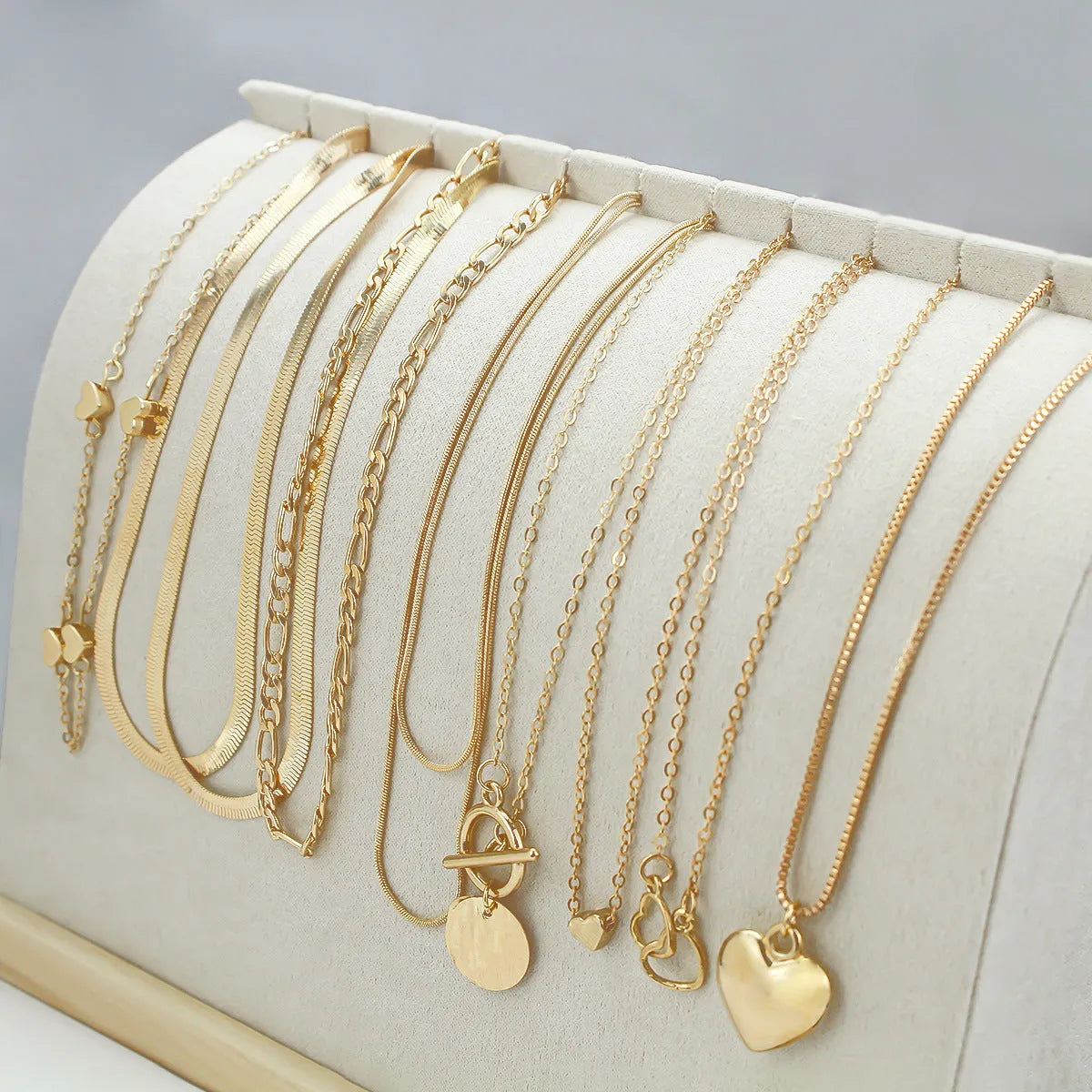 Gold women's necklace set with 10 alloy pendants on adjustable snake bone chain