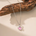 Geometric shell pendant necklace with electroplated copper pendant on stainless steel O-shaped chain, close-up view