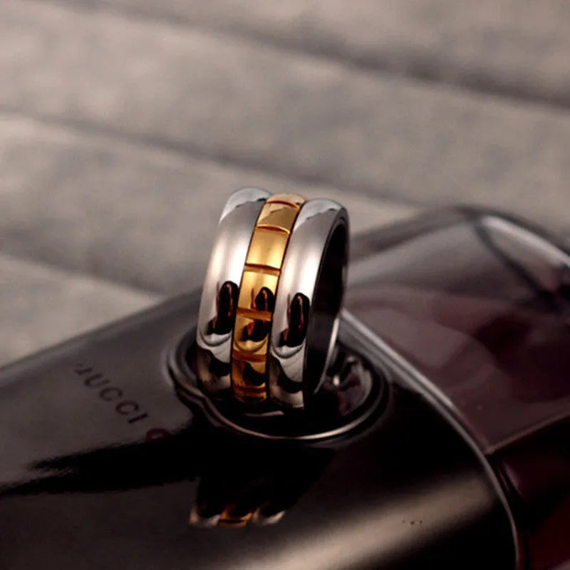 Gold titanium steel knuckle ring with ultra-wide design and rotatable tail mechanism