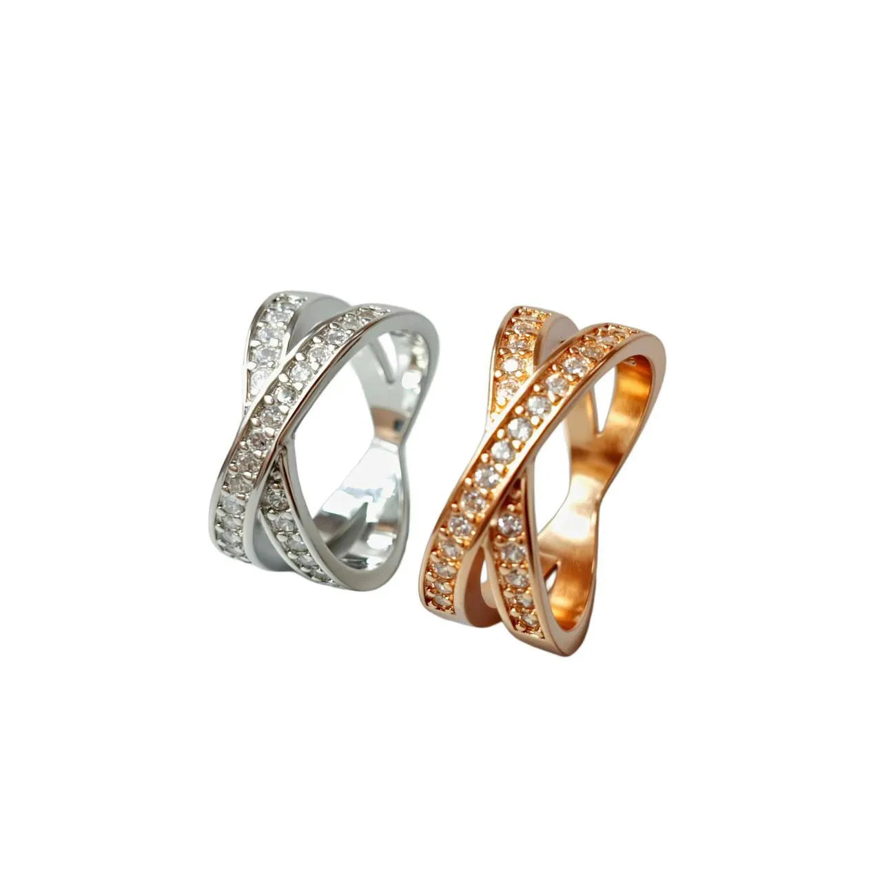 Simple silver cross ring with micro-inlaid zircon detail on a model's finger.