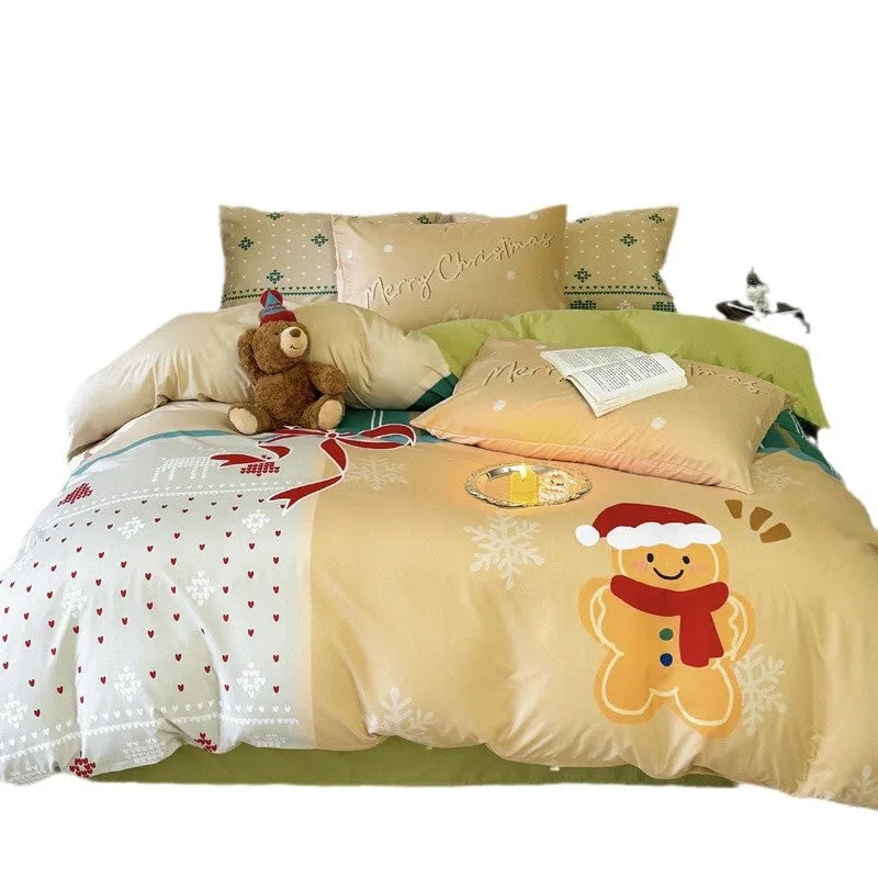 Christmas cartoon printed four-piece bedding set with quilt cover, sheet, and pillowcases on a bed.