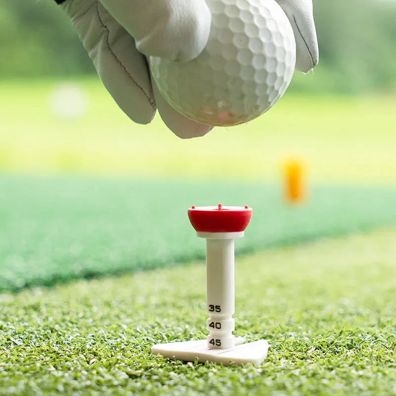 Golf tee ball nail can aim direction trainer in silicone reinforced plastic, available in red, green, blue, and orange colours