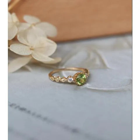 Copper women's ring with a green geometric quadrilateral stone in a Japanese style design.